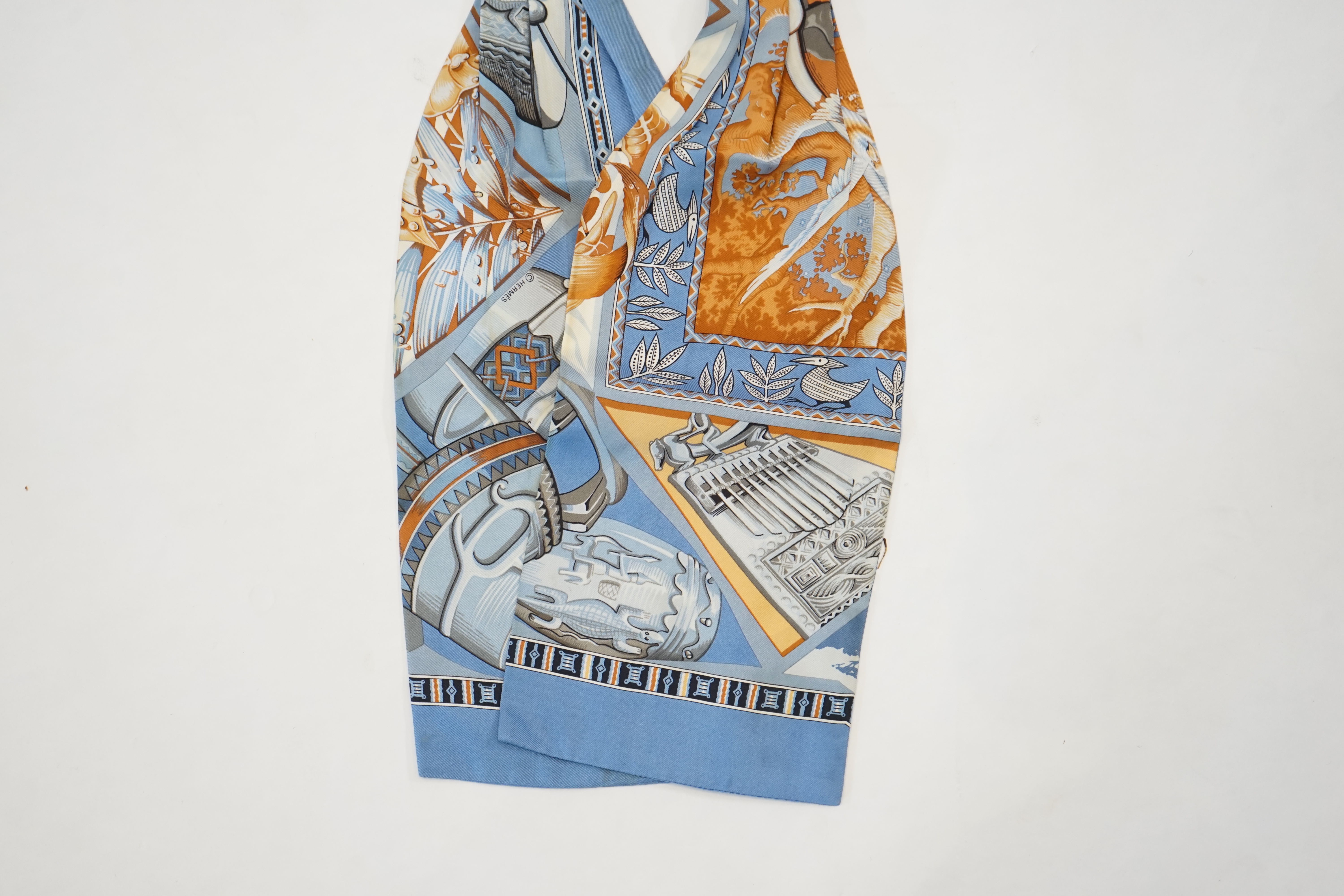 A Hermès silk cravat in ethnographic pattern, length 127cm x 18cm